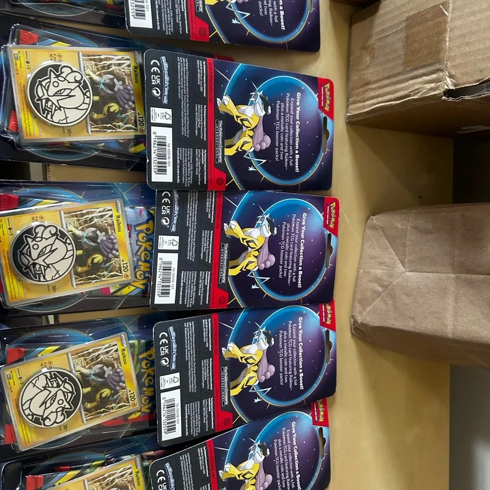 Lot of 10 Pokémon TCG booster double pack with two packs inside featuring Raikou